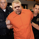 Luis Miguel Salvador Aguila Dominguez, alias "Lou Dobbs," is escorted by DHS agents to the airport to be sent back to Mexico.
